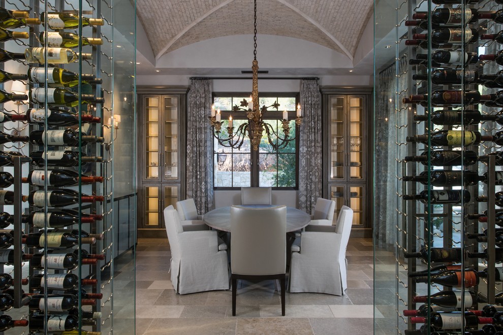 This is an example of a transitional wine cellar in Phoenix with storage racks.