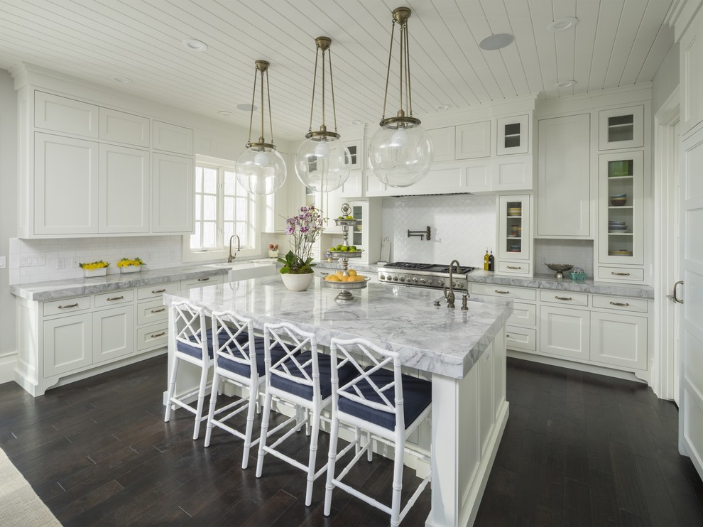 Transitional l-shaped kitchen in Salt Lake City with white cabinets, white splashback, stainless steel appliances, dark hardwood floors and with island.