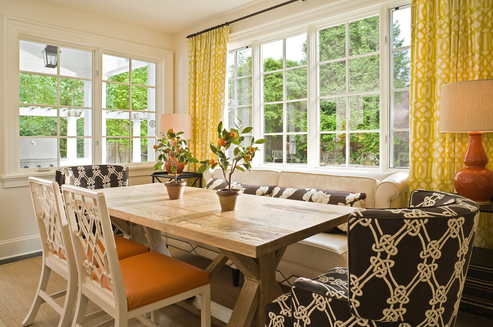 This is an example of a traditional dining room in Seattle with white walls.