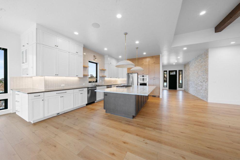 Example of a transitional kitchen design in Denver