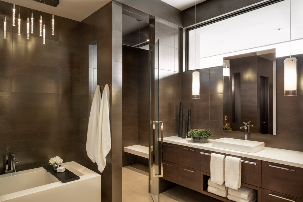 Photo of an expansive modern master bathroom in Phoenix with flat-panel cabinets, dark wood cabinets, an alcove tub, an alcove shower, brown tile, brown walls, travertine floors, a vessel sink, solid surface benchtops, white floor, a hinged shower door, white benchtops, a shower seat and a floating vanity.