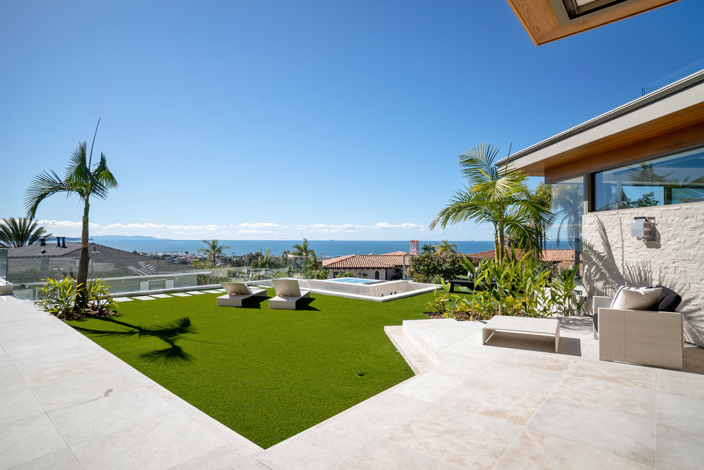 This is an example of a large contemporary backyard landscaping in Los Angeles.