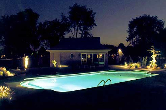 Inspiration for a backyard stone and custom-shaped pool remodel