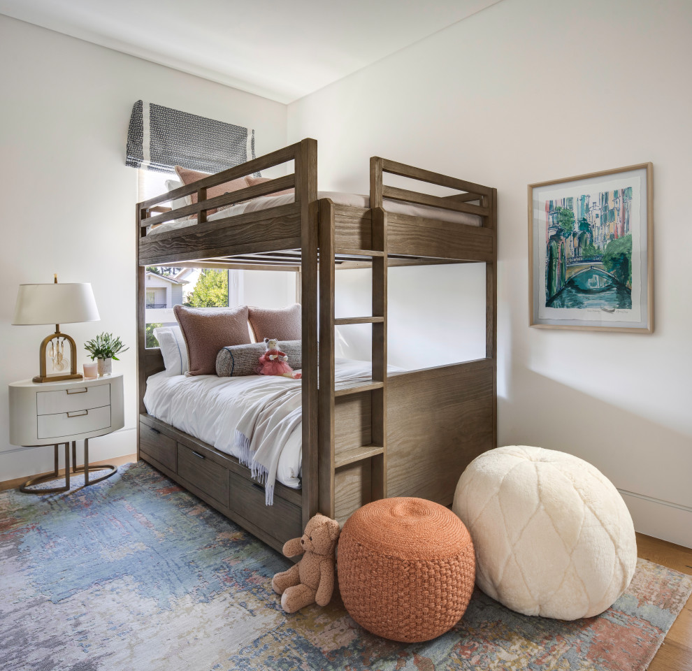 Kids' bedroom - contemporary gender-neutral medium tone wood floor and brown floor kids' bedroom idea in Orange County with white walls