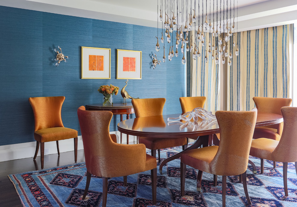 Inspiration for a mid-sized transitional dining room in Boston with blue walls and dark hardwood floors.