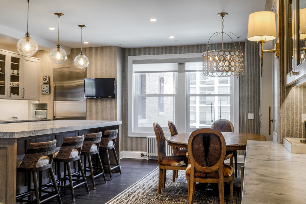 Mid-sized contemporary l-shaped eat-in kitchen in Chicago with shaker cabinets, white cabinets, granite benchtops, stainless steel appliances, dark hardwood floors, with island and brown floor.