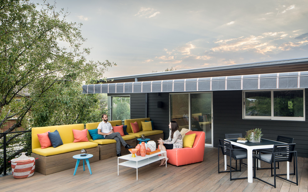 Mid-sized trendy rooftop balcony deck photo in Denver with an awning