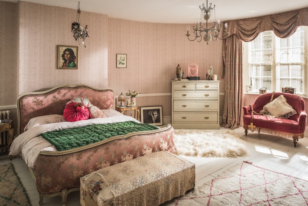 Traditional bedroom in Other with pink walls, painted wood floors and white floor.