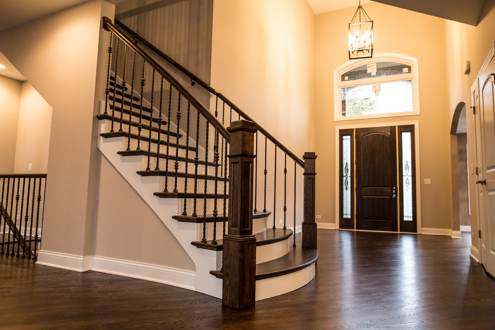 Mid-sized transitional dark wood floor home design photo in Chicago with brown walls and a black front door