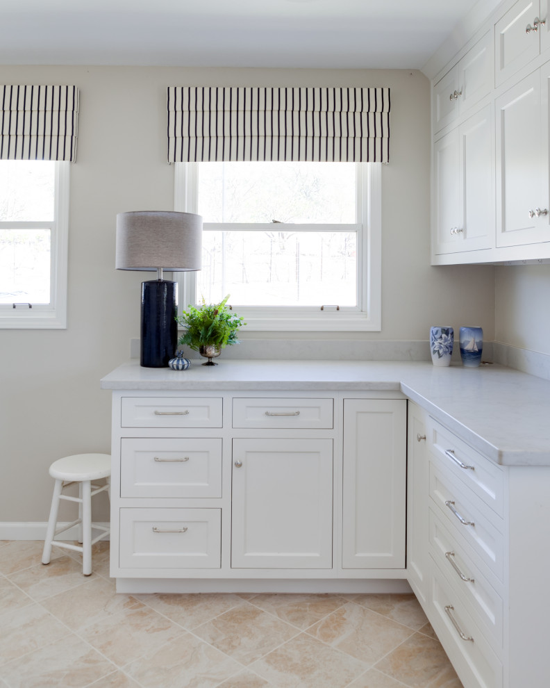 Design ideas for a mid-sized traditional l-shaped dedicated laundry room in Sacramento with beaded inset cabinets, white cabinets, quartz benchtops, beige walls, medium hardwood floors, a side-by-side washer and dryer, yellow floor and white benchtop.