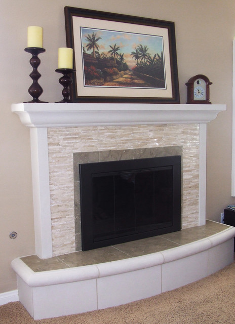 Remodel of brick fireplace. Split-face travertine cladding with limestone trim and hearth stone.