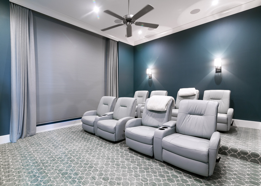 Inspiration for a large beach style open concept home theatre in Birmingham with blue walls, carpet and a built-in media wall.