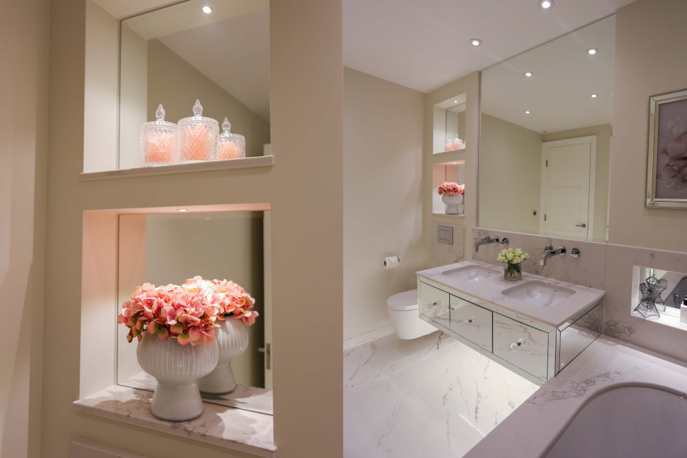 Идея дизайна: главная ванная комната в стиле модернизм с стеклянными фасадами, накладной ванной, инсталляцией, белыми стенами, полом из керамической плитки, накладной раковиной, белым полом, белой столешницей, тумбой под две раковины и подвесной тумбой