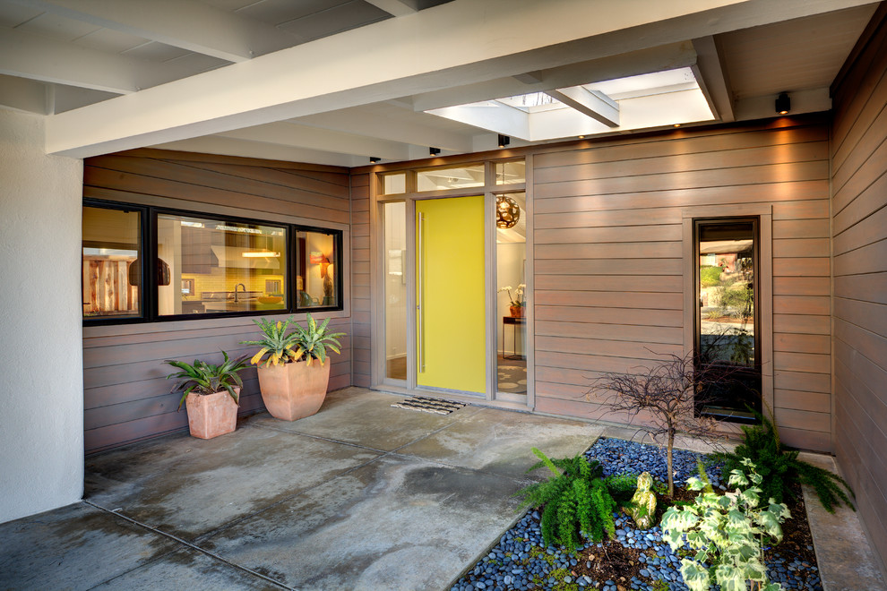 Design ideas for a mid-sized contemporary entryway in San Francisco with a single front door and a yellow front door.
