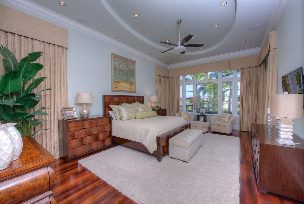 This is an example of a transitional bedroom in Tampa.