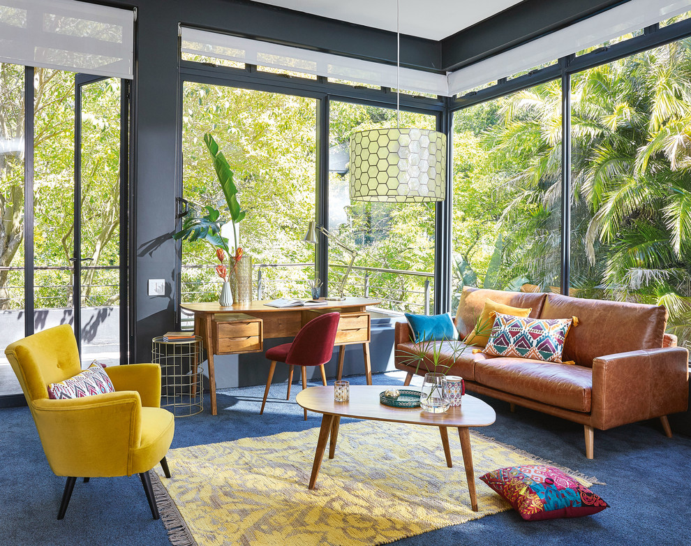 Design ideas for an eclectic formal living room in London with black walls, carpet and blue floors.