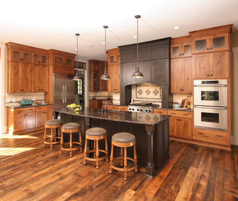 Inspiration for a traditional kitchen in Charlotte with stainless steel appliances.
