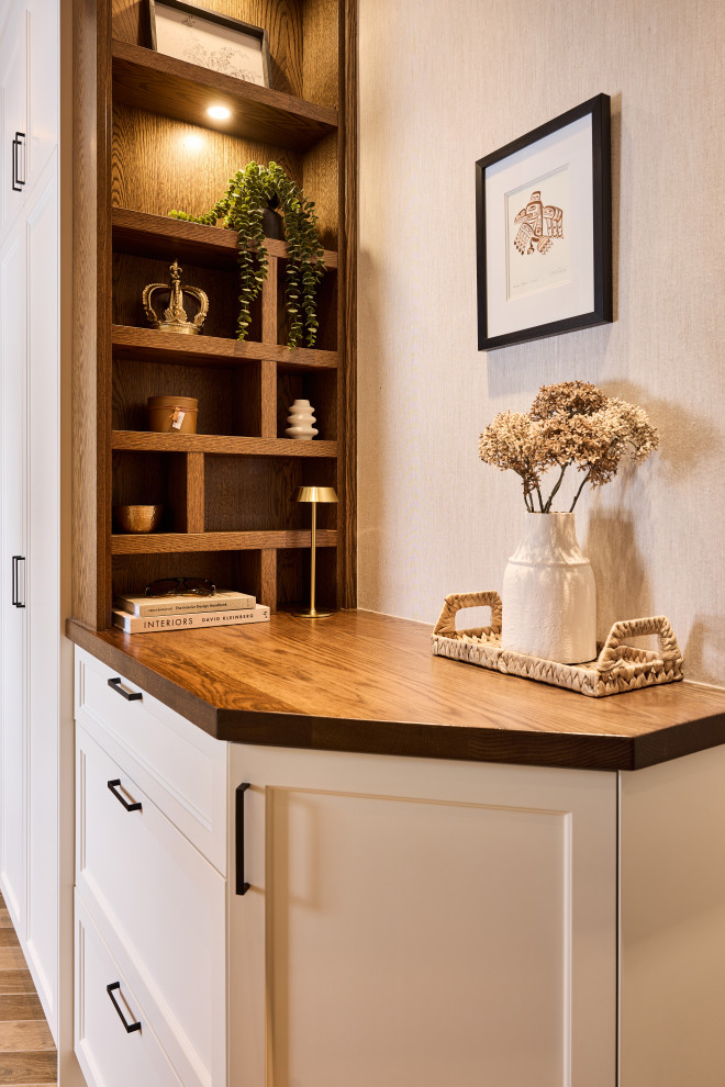 Mid-sized transitional porcelain tile, brown floor, tray ceiling and wallpaper mudroom photo in Ottawa with multicolored walls and a black front door
