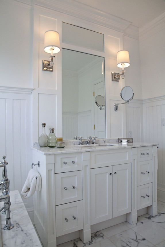 Inspiration for a mid-sized country master bathroom in New York with shaker cabinets, white cabinets, white walls, marble floors, an undermount sink, marble benchtops, white floor and an undermount tub.