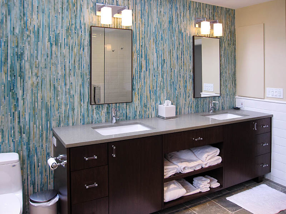 Mid-sized contemporary master bathroom in New York with an undermount sink, flat-panel cabinets, dark wood cabinets, granite benchtops, a one-piece toilet, blue tile, mosaic tile, beige walls and slate floors.