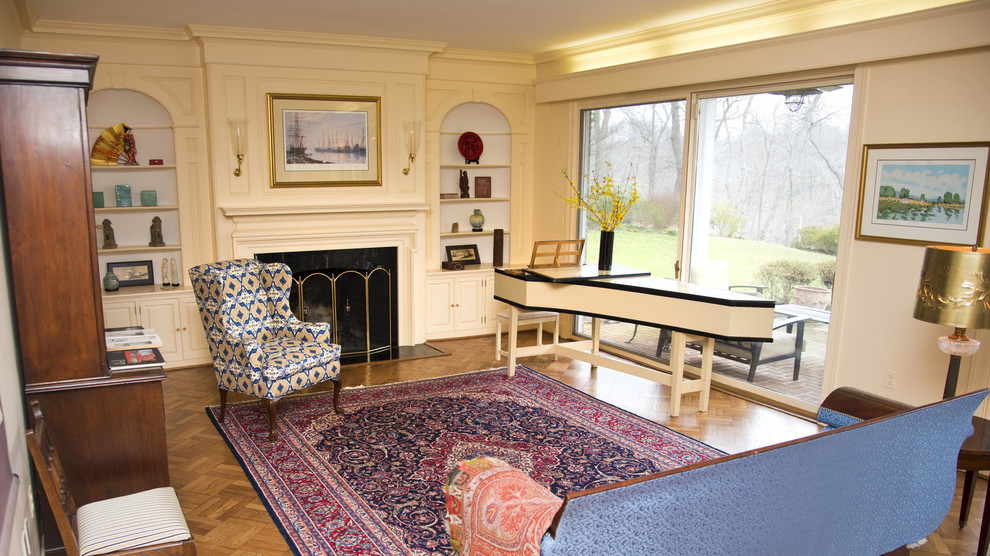 This is an example of a mid-sized traditional formal enclosed living room in Baltimore with beige walls, dark hardwood floors, a standard fireplace, a plaster fireplace surround, no tv and brown floor.