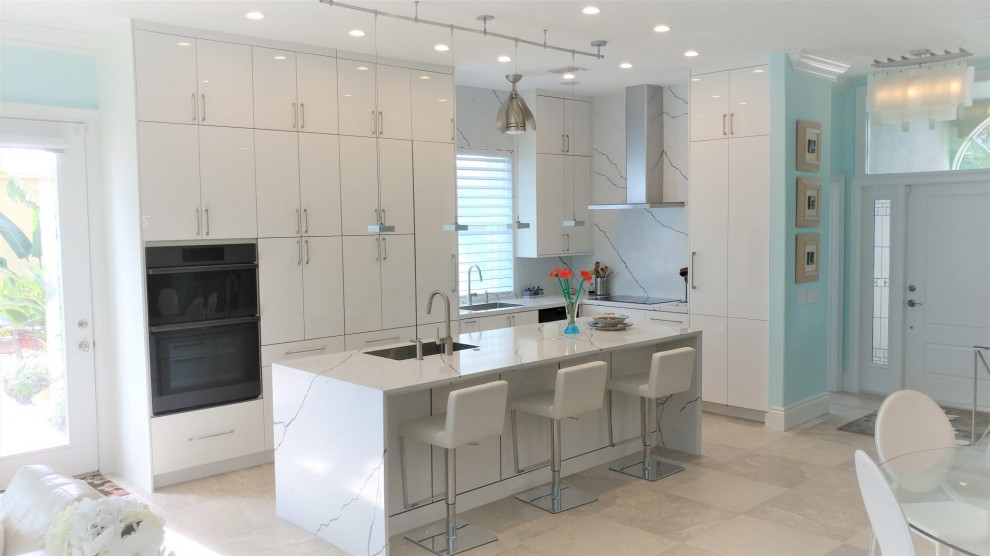 Inspiration for a mid-sized modern l-shaped eat-in kitchen in Other with an undermount sink, flat-panel cabinets, white cabinets, quartz benchtops, white splashback, engineered quartz splashback, with island and white benchtop.