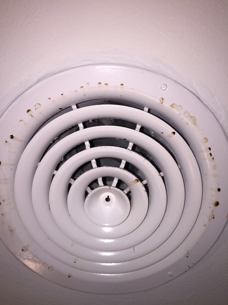 Brown/Black drip stains on circular AC vents?