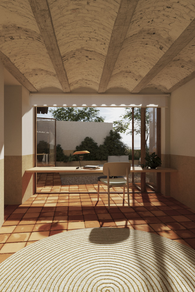 Small rural study in Madrid with white walls, terracotta flooring, a built-in desk, orange floors and a vaulted ceiling.