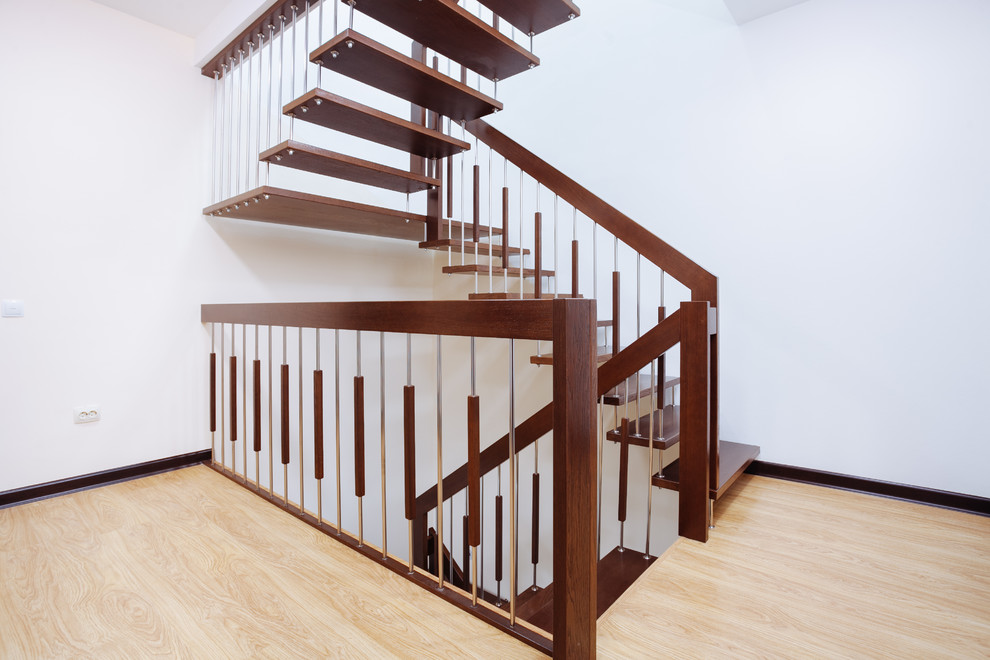 Mid-sized contemporary wood u-shaped staircase in Other with mixed railing.