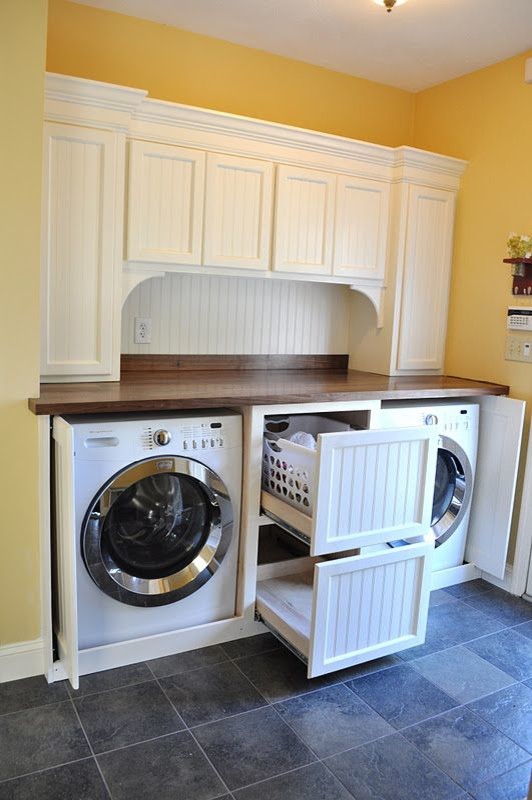 This is an example of a mid-sized contemporary laundry room in Charlotte with brown benchtop.