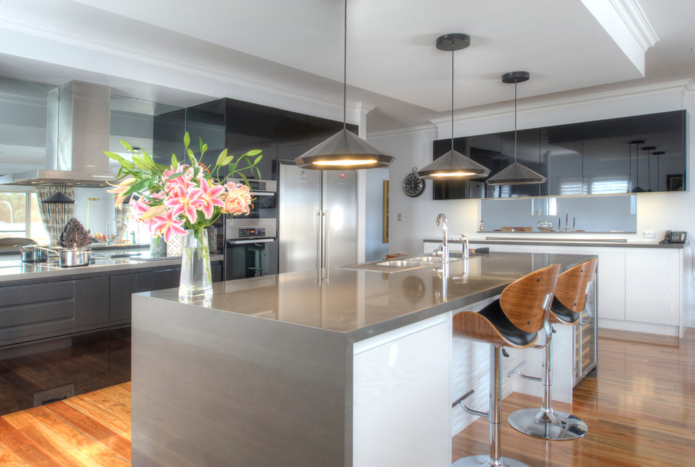 Contemporary kitchen in Sydney with with island.