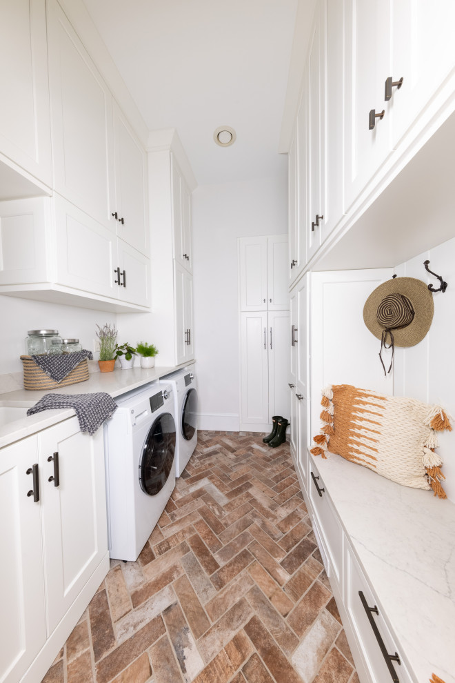 Inspiration for a mid-sized timeless terra-cotta tile and multicolored floor laundry room remodel in Richmond with an undermount sink, shaker cabinets, white cabinets, marble countertops, white walls, a side-by-side washer/dryer and white countertops