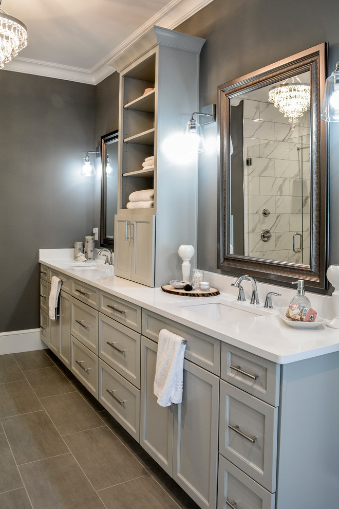 Mid-sized transitional master bathroom in Other with shaker cabinets, grey cabinets, a double shower, a two-piece toilet, gray tile, porcelain tile, grey walls, porcelain floors, an undermount sink, engineered quartz benchtops, grey floor, a hinged shower door and white benchtops.