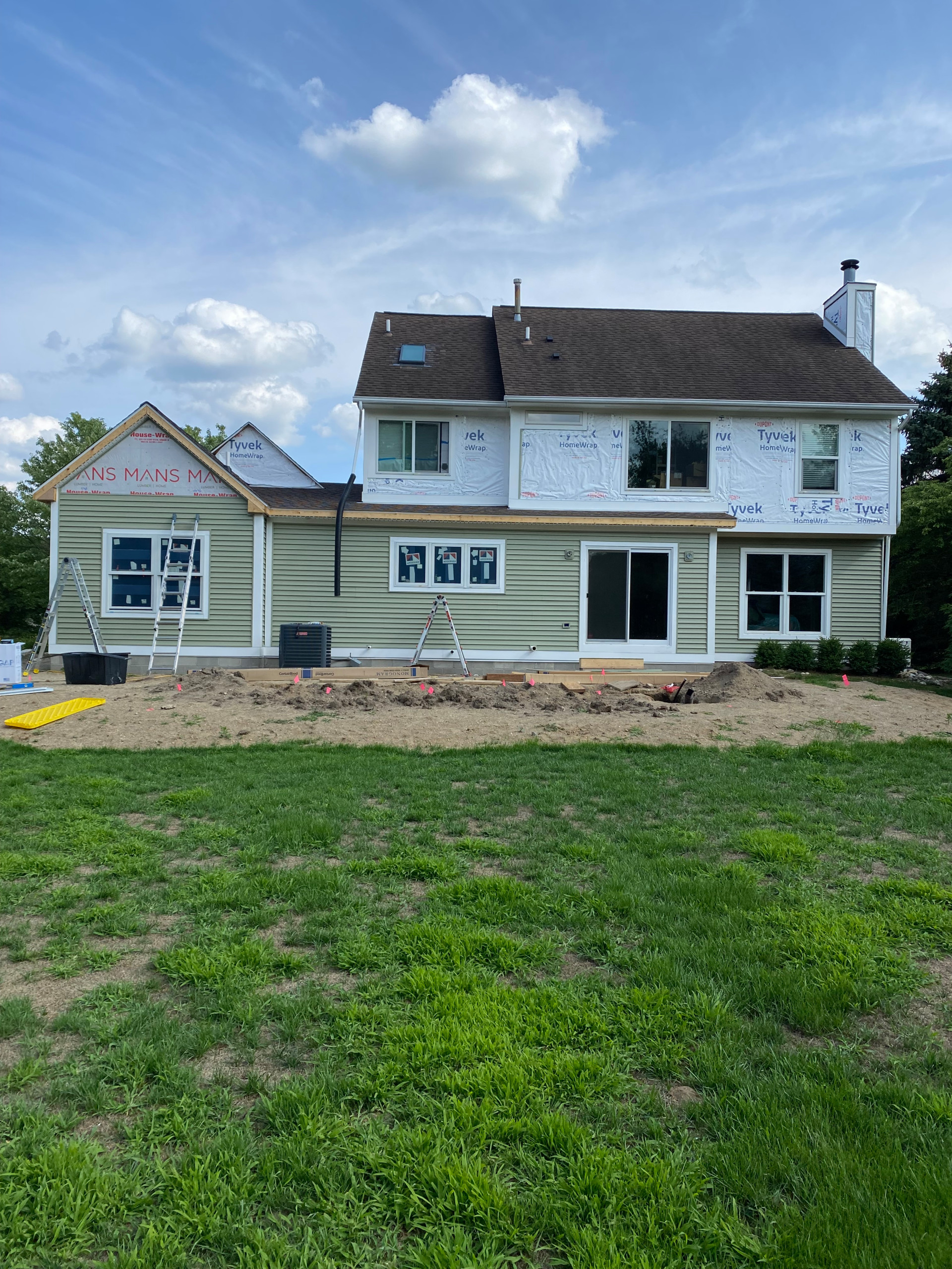 Lake Orion addition with kitchen, baths, office, siding and patio.