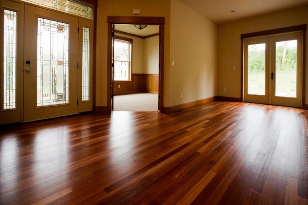 Example of a large transitional medium tone wood floor foyer design in Baltimore