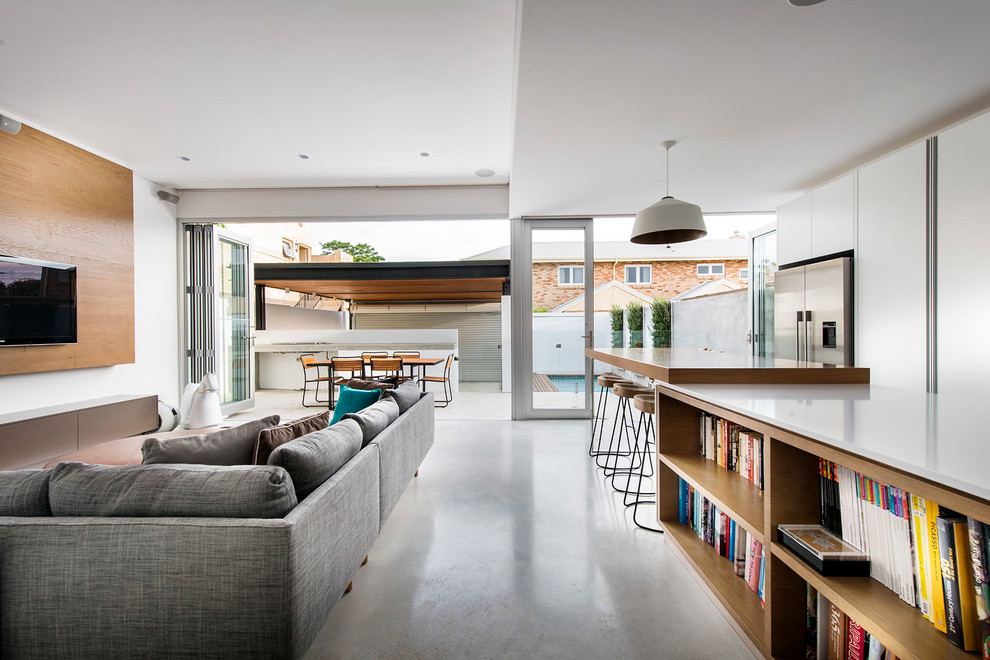 Photo of a contemporary formal open concept living room in Perth with white walls and a wall-mounted tv.