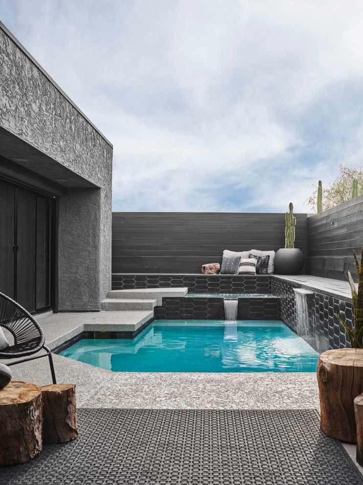 Design ideas for a contemporary custom-shaped pool in Phoenix with a water feature.