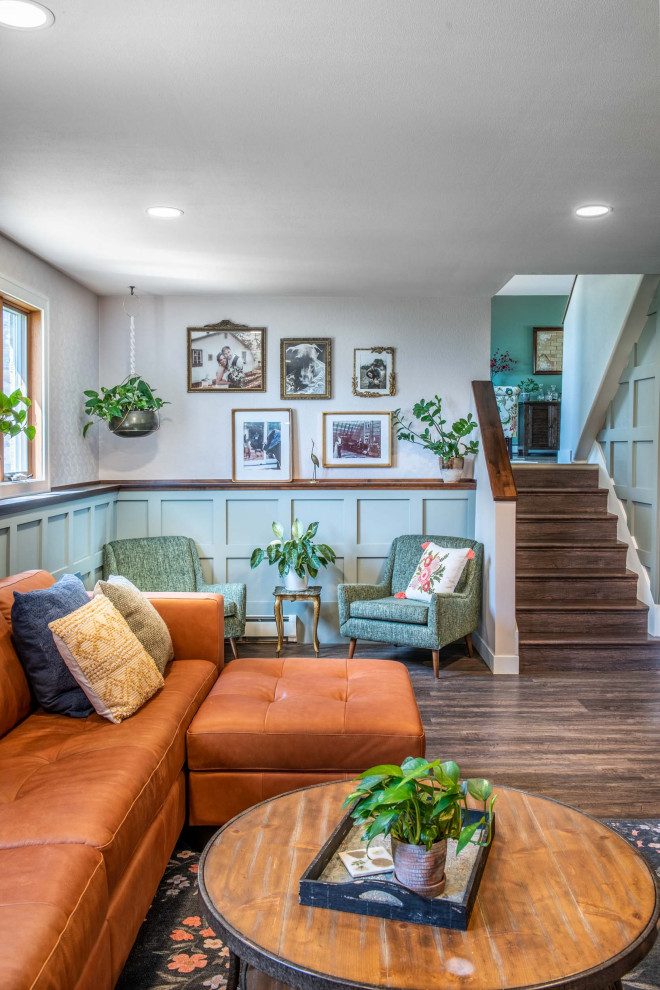 Example of a mid-sized eclectic wainscoting family room design in Other