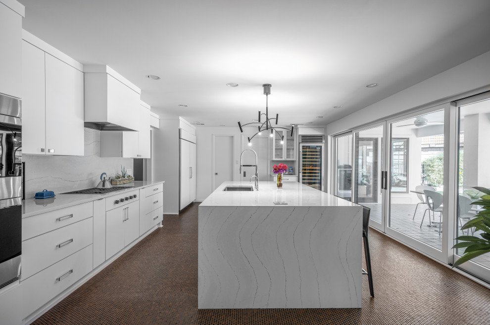 Design ideas for a large contemporary l-shaped separate kitchen in Dallas with an undermount sink, flat-panel cabinets, white cabinets, marble benchtops, white splashback, marble splashback, stainless steel appliances, ceramic floors, with island, brown floor and white benchtop.