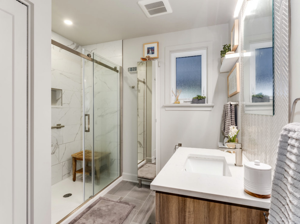 Example of a small trendy porcelain tile porcelain tile and single-sink bathroom design in Ottawa with flat-panel cabinets, light wood cabinets, an undermount sink, quartz countertops, white countertops, a niche and a floating vanity
