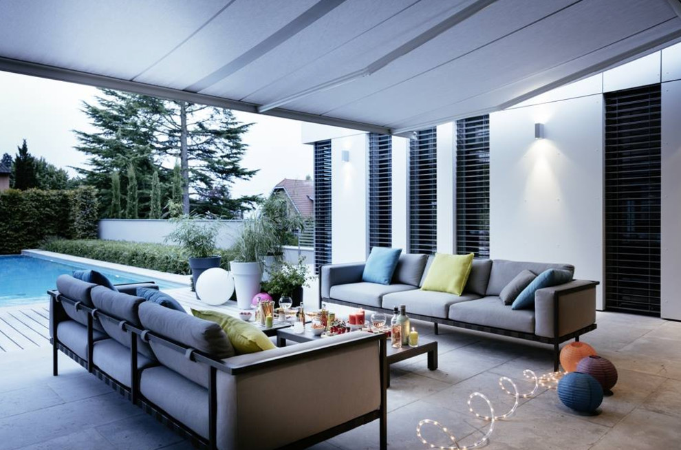 Inspiration for a mid-sized transitional backyard deck remodel in Phoenix with an awning