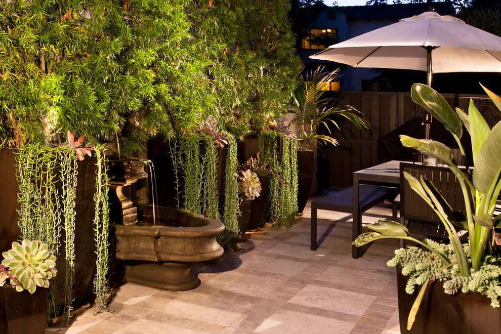 Contemporary patio in Los Angeles with a water feature.