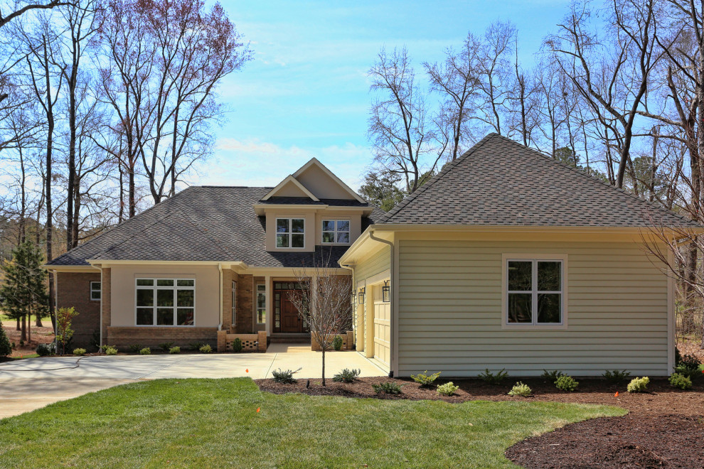 Home design - large transitional home design idea in Raleigh