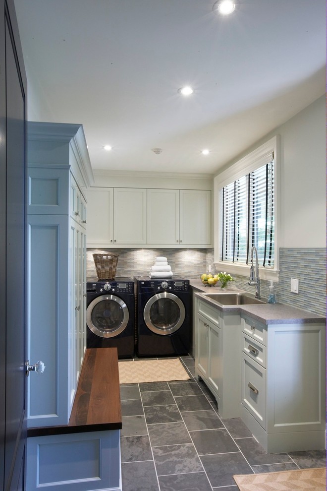 Design ideas for a contemporary laundry room in Toronto with slate floors.