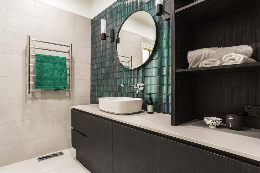 Photo of a large contemporary master bathroom in Melbourne with green tile, matchstick tile, ceramic floors, a vessel sink, engineered quartz benchtops, a hinged shower door and beige benchtops.