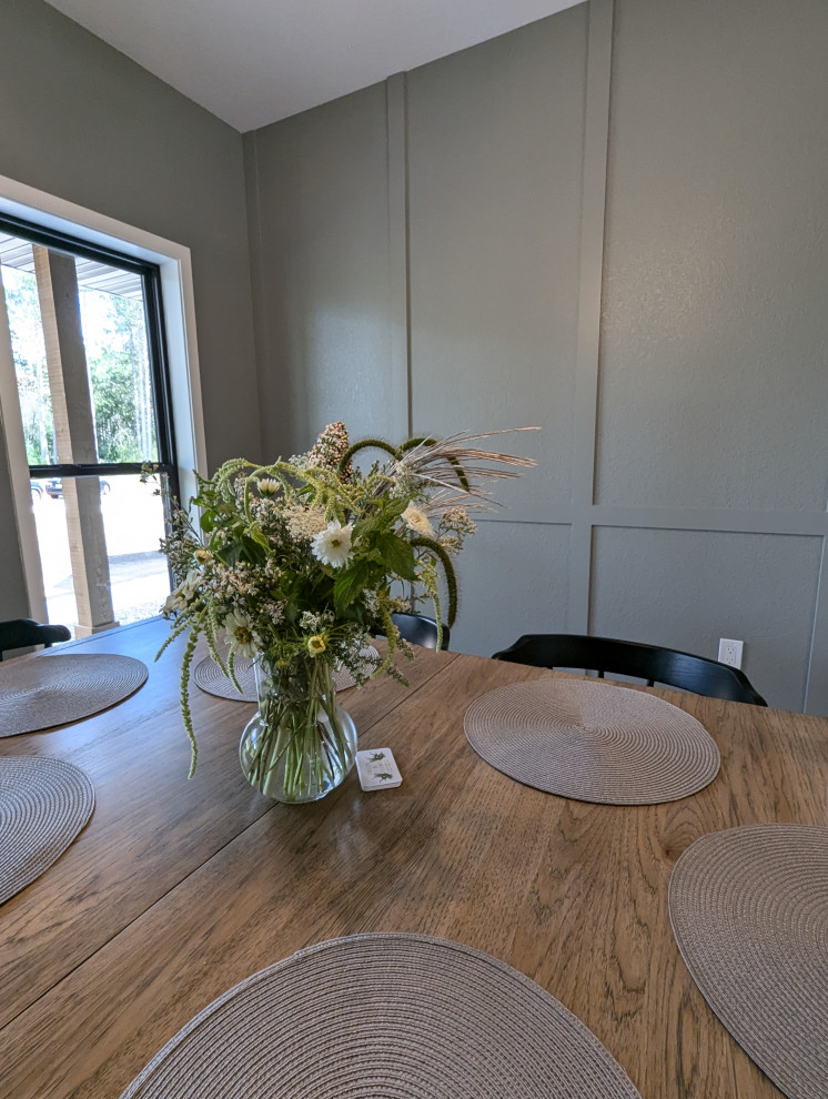 Example of a large transitional l-shaped vinyl floor and brown floor eat-in kitchen design with a double-bowl sink, shaker cabinets, light wood cabinets, quartzite countertops, white backsplash, ceramic backsplash, stainless steel appliances, an island and white countertops