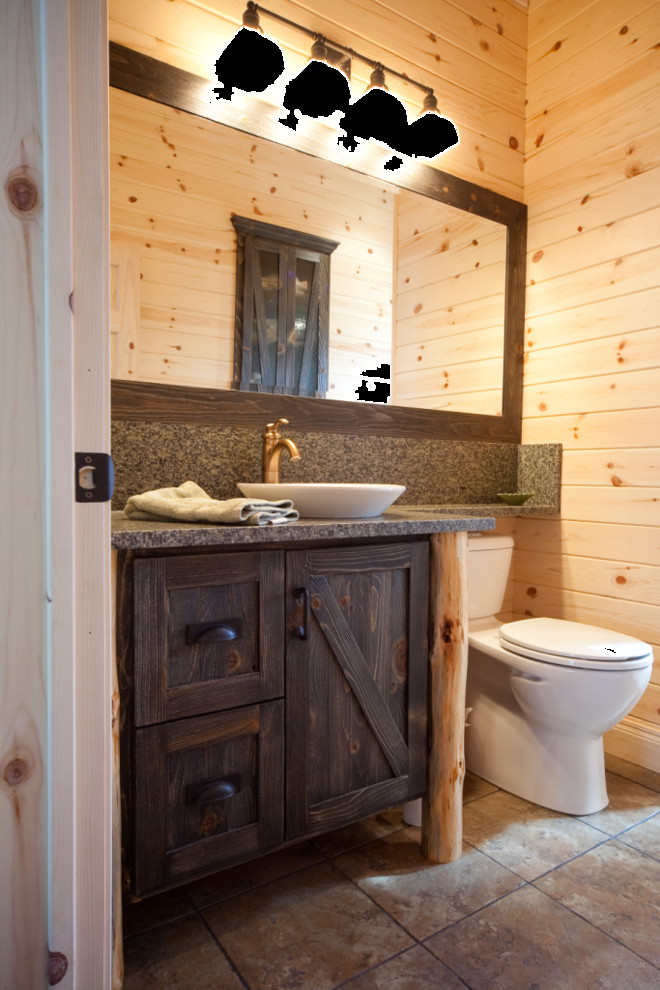 Inspiration for a mid-sized country powder room in Other with furniture-like cabinets, distressed cabinets, a one-piece toilet, beige walls, ceramic floors, a vessel sink and granite benchtops.