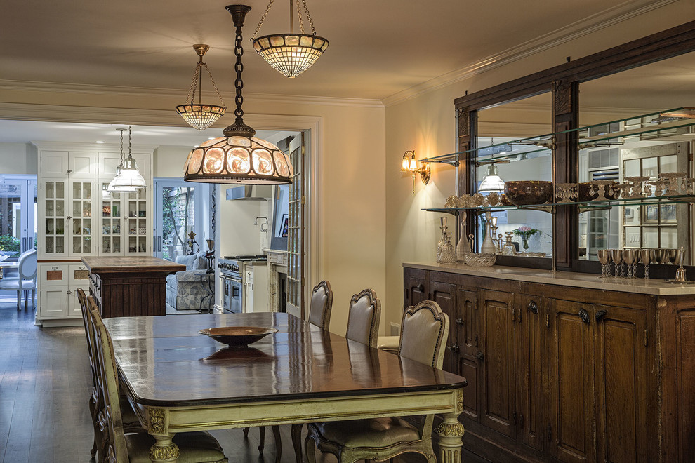 Large traditional separate dining room in New York with beige walls, dark hardwood floors and no fireplace.