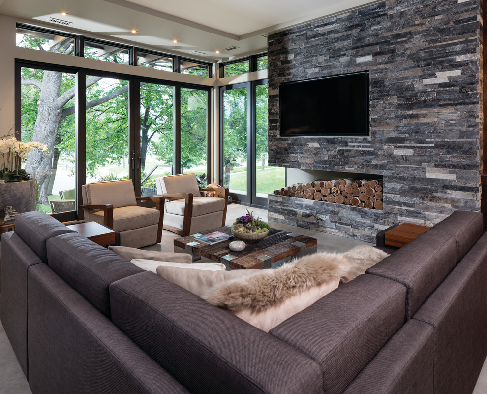 Mid-sized modern formal open concept living room in Minneapolis with grey walls, concrete floors, no fireplace and a built-in media wall.