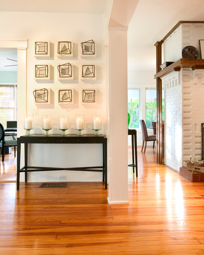 This is an example of a traditional hallway in Miami with white walls.
